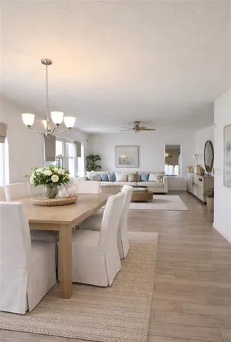 a lobby with furniture and a chandelier