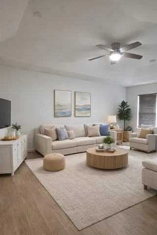 a living room with furniture and a large window