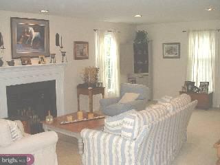 571 Gulph Road Wayne, PA 19087 - Photo 3 of 6 a bedroom with a bed and a fireplace