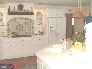 571 Gulph Road Wayne, PA 19087 - Photo 4 of 6 a bathroom with a tub sink and mirror