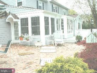 571 Gulph Road Wayne, PA 19087 - Photo 5 of 6 a front view of a house with a yard
