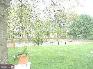 571 Gulph Road Wayne, PA 19087 - Photo 6 of 6 a view of yard with green space and trees in the background