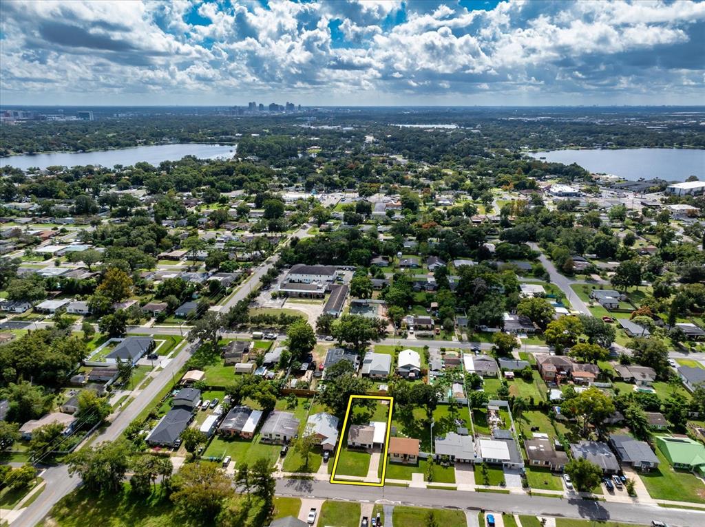 916 Timor Avenue Orlando, FL 32804 - Photo 32 of 60 an aerial view of residential building with parking and trees