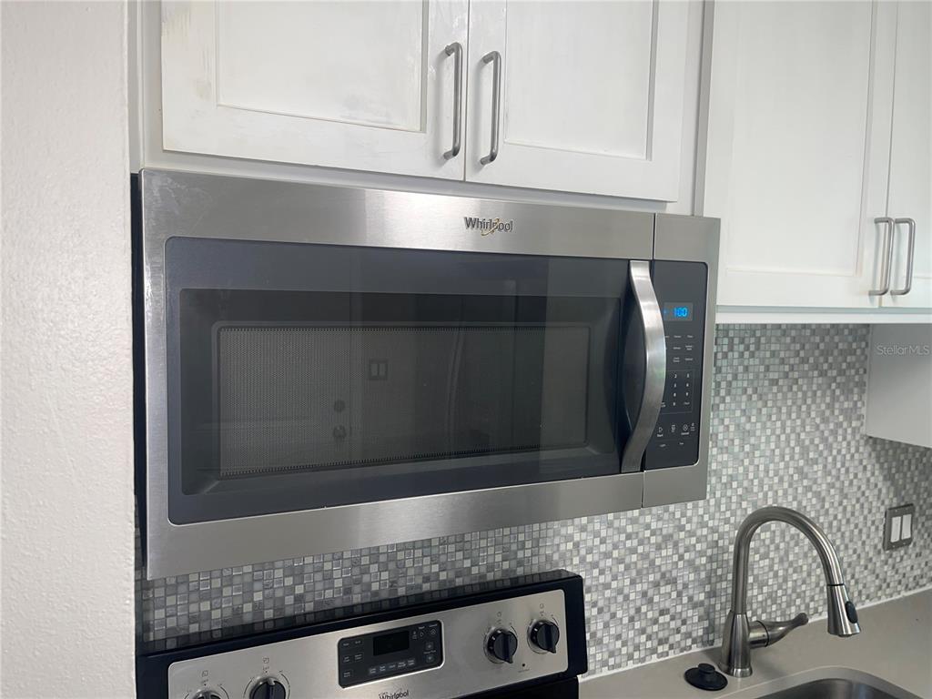 916 Timor Avenue Orlando, FL 32804 - Photo 38 of 60 a bathroom with a sink and a mirror