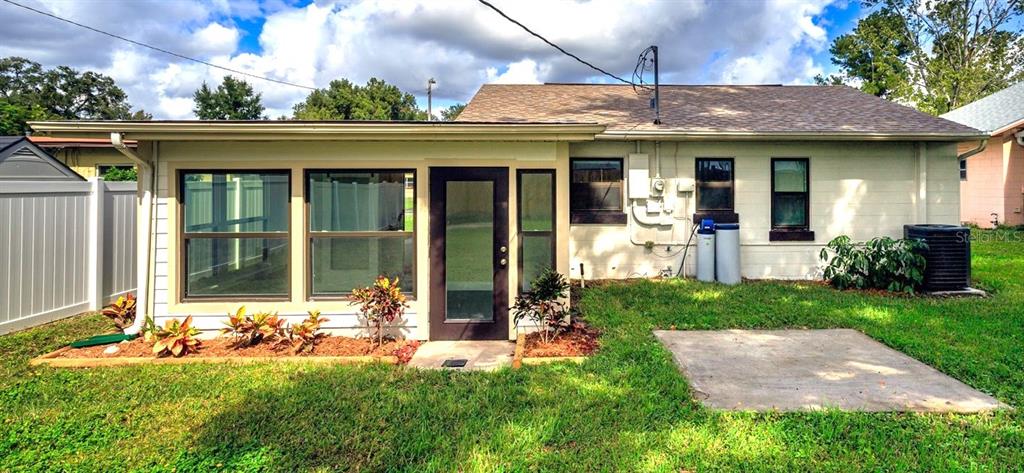 916 Timor Avenue Orlando, FL 32804 - Photo 10 of 60 a front view of a house with a yard table and chairs