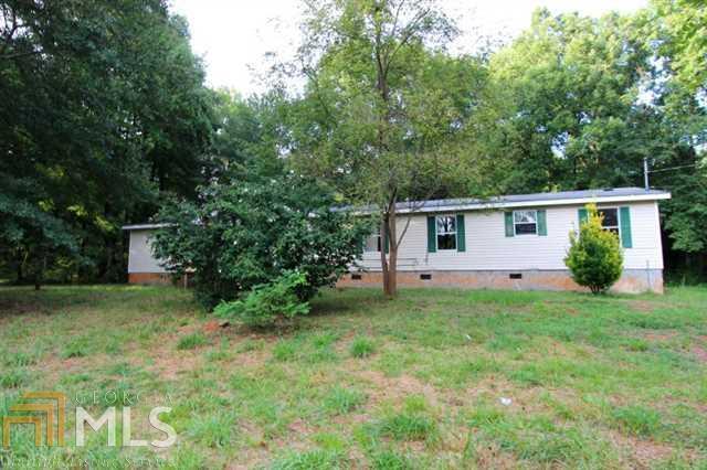 151 Southern Shores Road Jackson, GA 30233 - Photo 1 of 1 a view of a house with backyard and garden