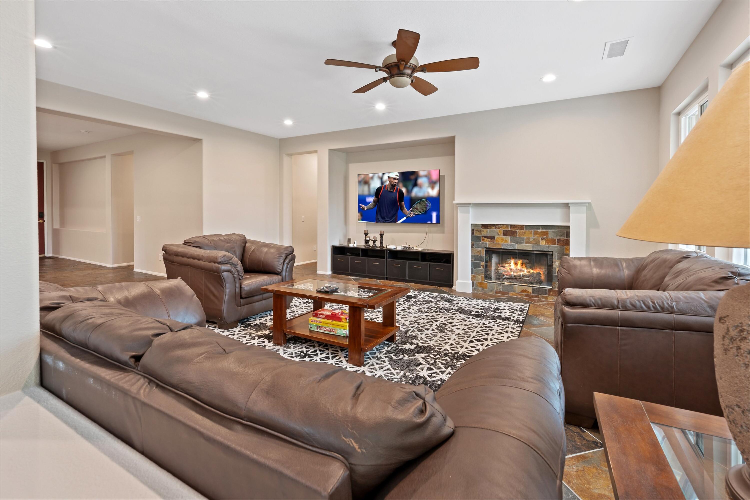 49335 Douglas Street Indio, CA 92201 - Photo 14 of 31 a living room with furniture and a fireplace
