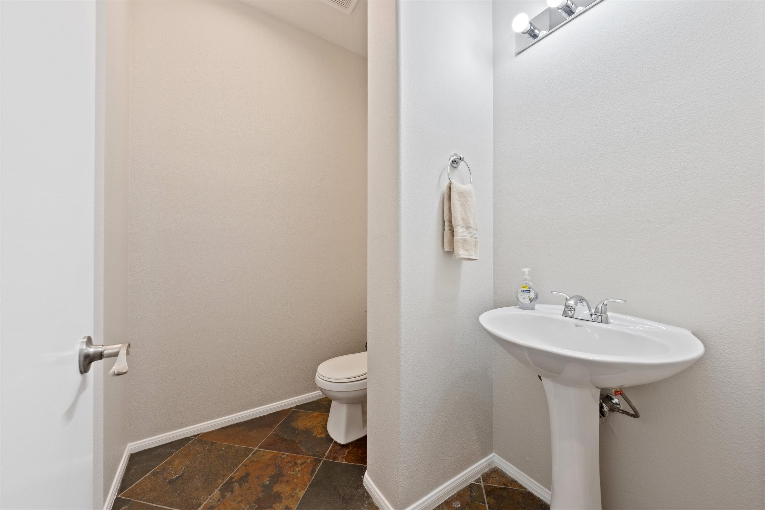 49335 Douglas Street Indio, CA 92201 - Photo 22 of 31 a bathroom with a sink toilet and a mirror