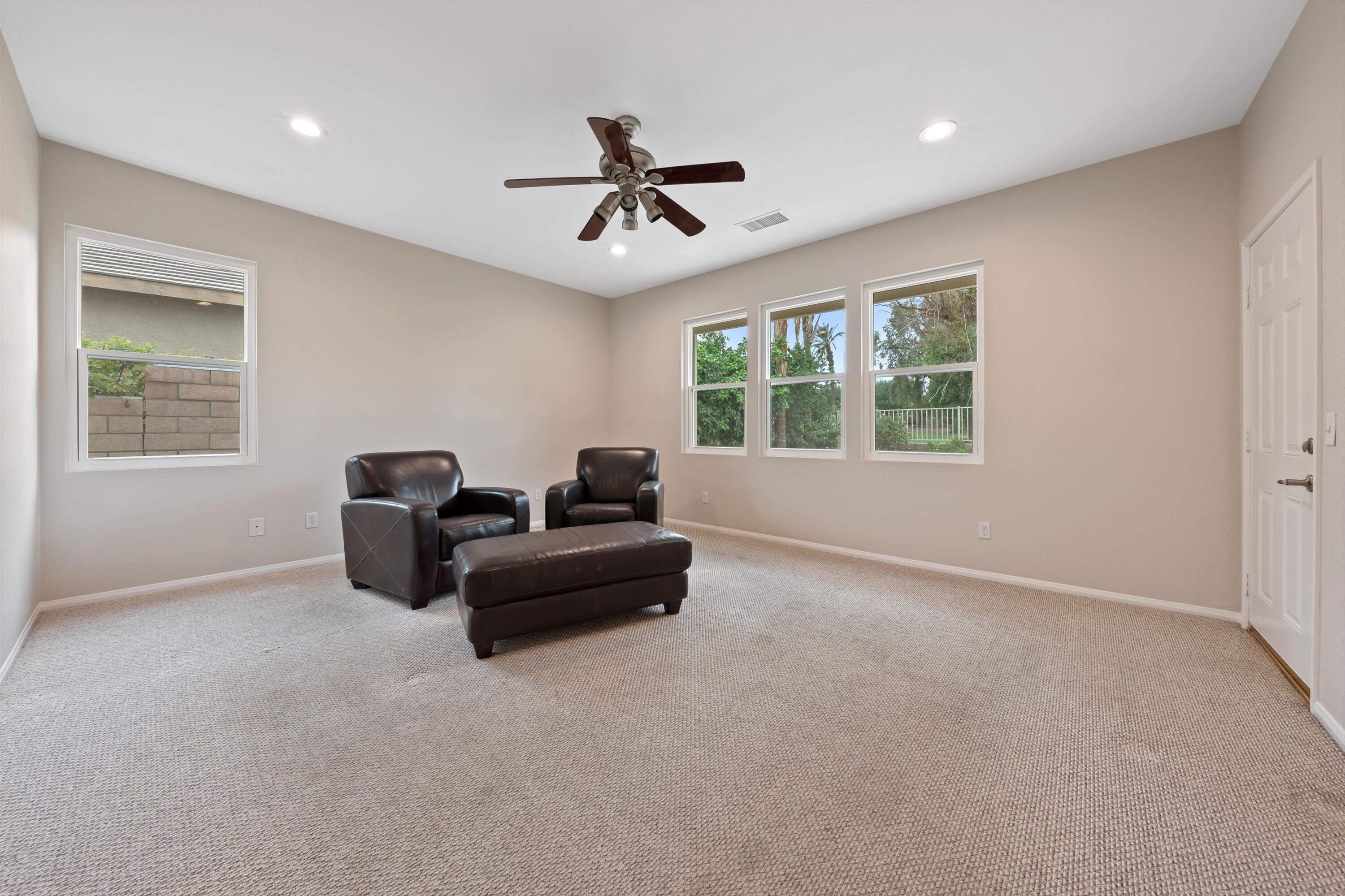 49335 Douglas Street Indio, CA 92201 - Photo 23 of 31 a living room with furniture and a window
