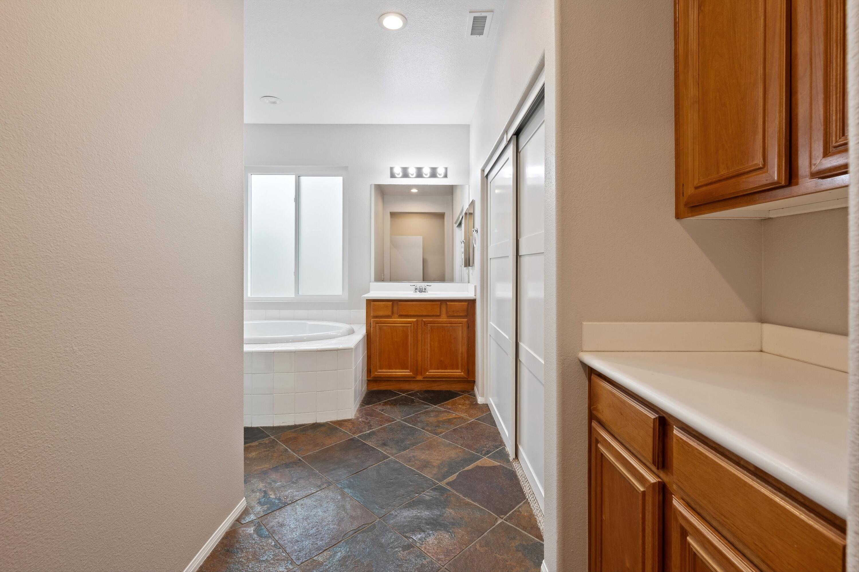 49335 Douglas Street Indio, CA 92201 - Photo 24 of 31 a bathroom with a sink and a mirror