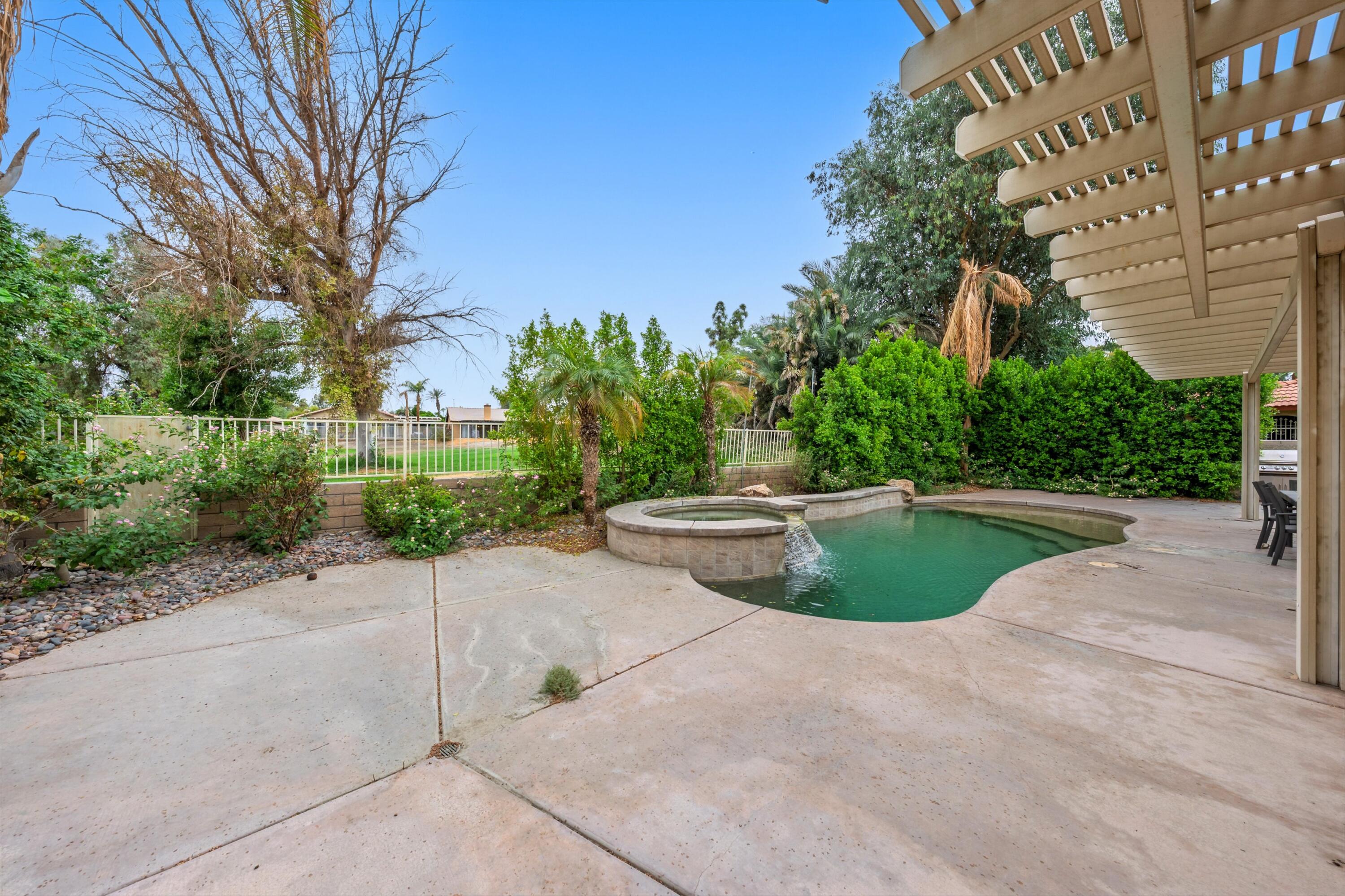 49335 Douglas Street Indio, CA 92201 - Photo 9 of 31 a view of outdoor space yard and swimming pool