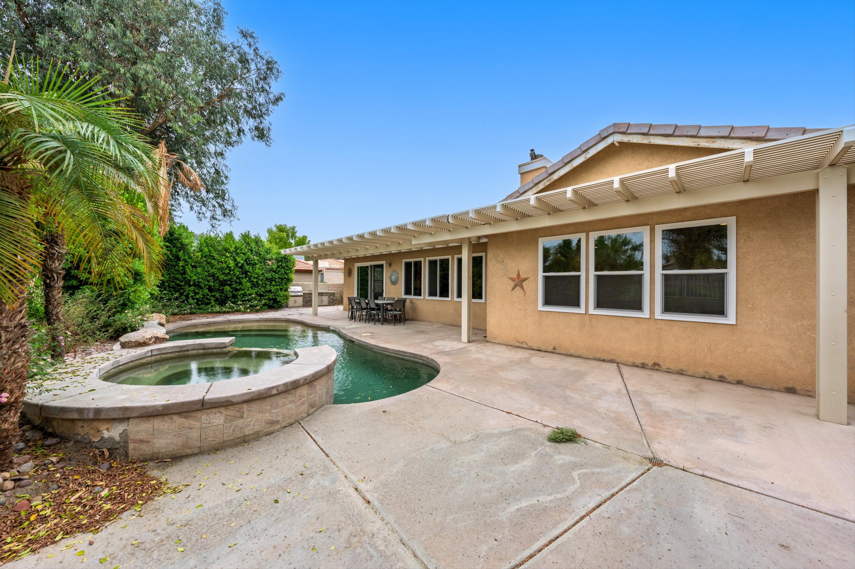 49335 Douglas Street Indio, CA 92201 - Photo 10 of 31 a view of a house with a yard and sitting area