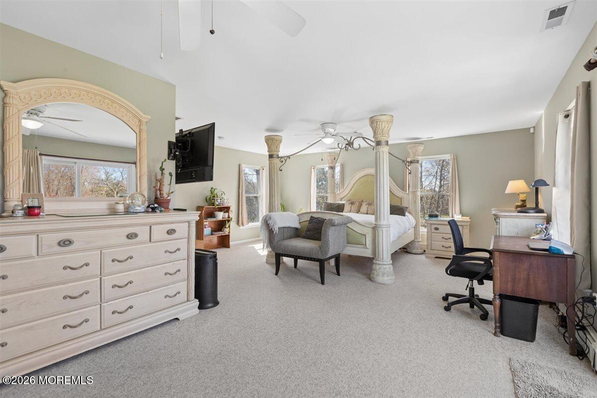 436 Cook Road Jackson, NJ 08527 - Photo 22 of 44 a living room with furniture and a mirror