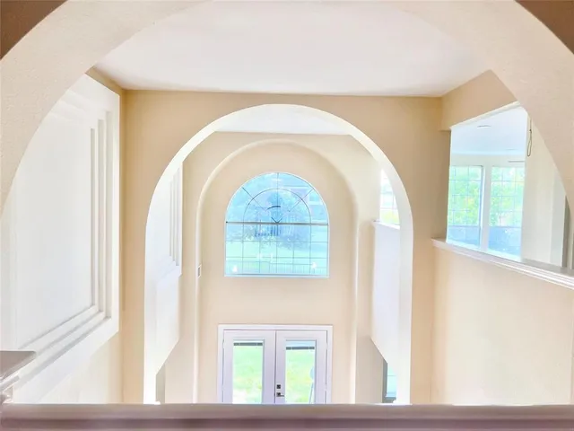 a view of an empty room with a window