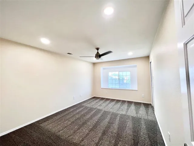 a bathroom with a double vanity sink toilet and a mirror