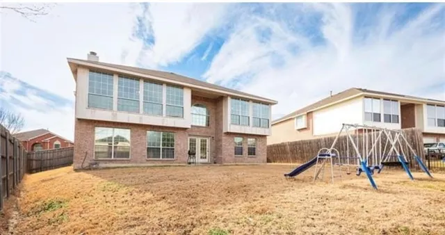 a house view with a backyard space
