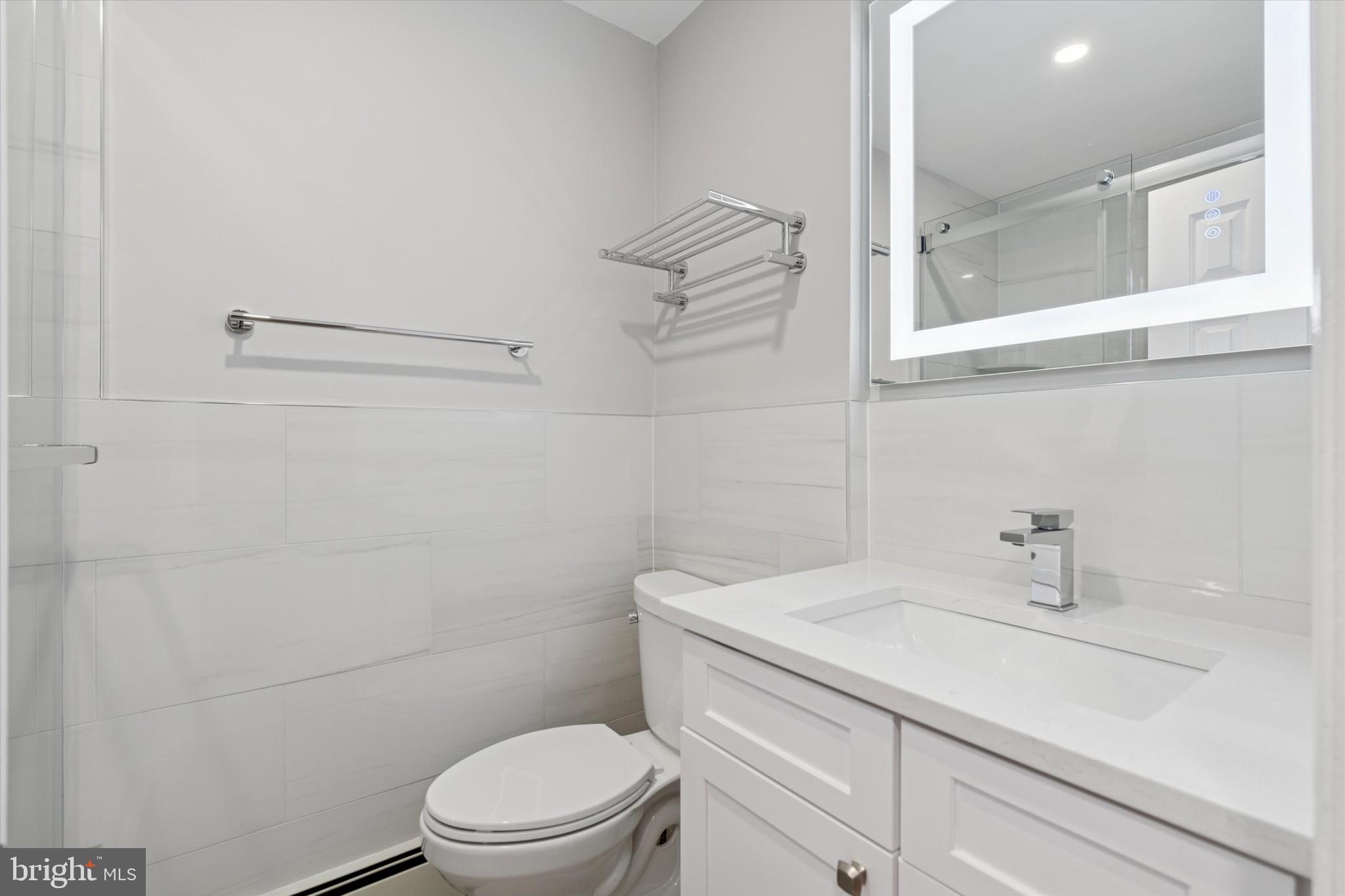 508 Stidman Drive, Unit C1 Springfield, PA 19064 - Photo 12 of 21 a bathroom with a sink a toilet and shower