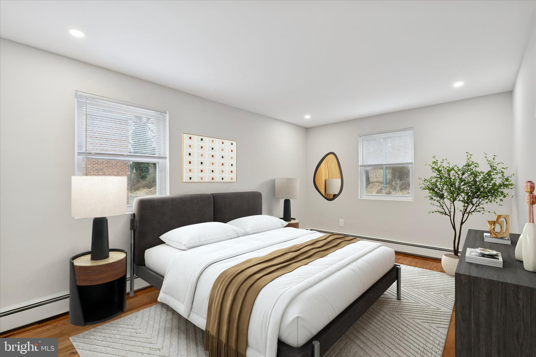 508 Stidman Drive, Unit C1 Springfield, PA 19064 - Photo 15 of 21 a bedroom with a bed and a table