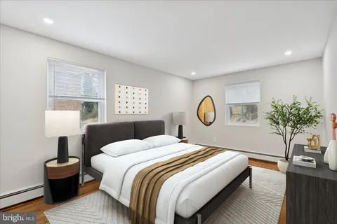 a bedroom with a bed and a table