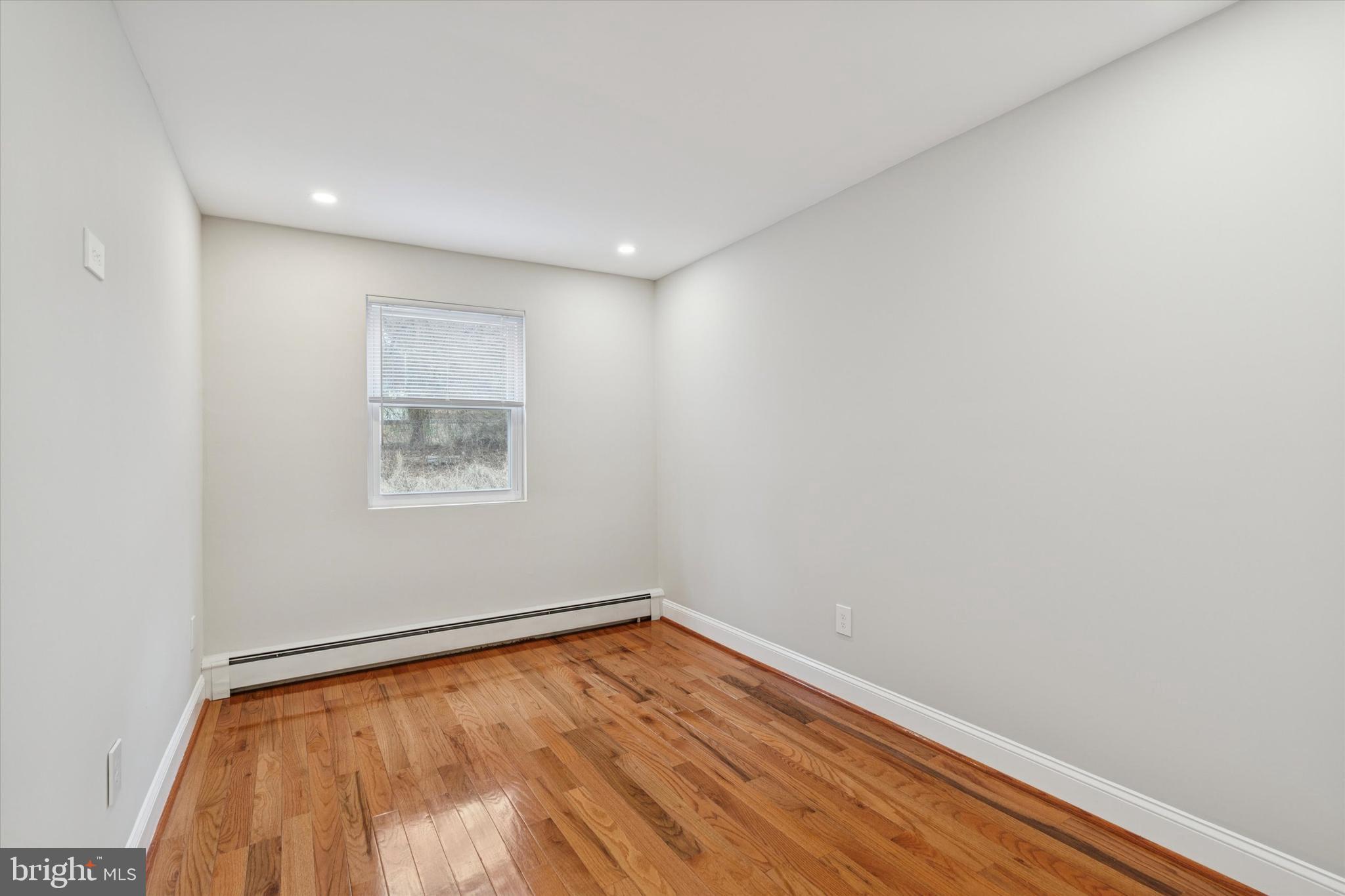 508 Stidman Drive, Unit C1 Springfield, PA 19064 - Photo 17 of 21 a view of room with wooden floor and fan
