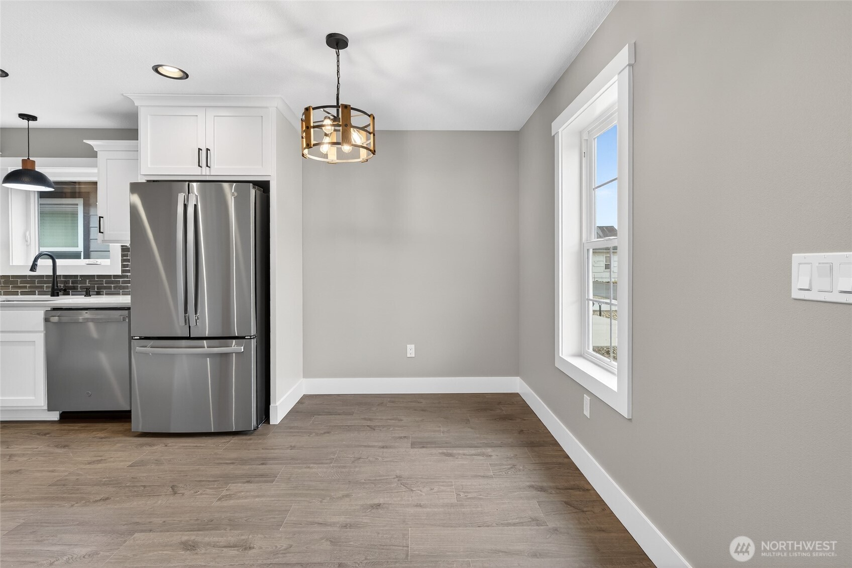 111 7th Street Southwest Long Beach, WA 98631 - Photo 12 of 30 a kitchen with stainless steel appliances a refrigerator and a window