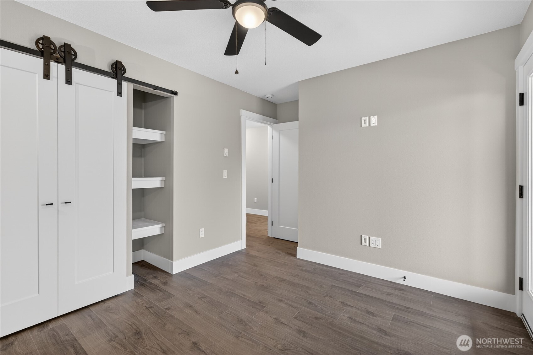 111 7th Street Southwest Long Beach, WA 98631 - Photo 21 of 30 an empty room with wooden floor closet and windows