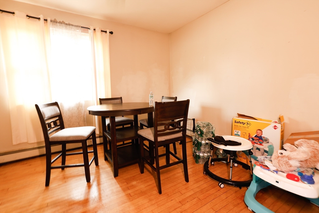 2 Horne Street Methuen, MA 01844 - Photo 3 of 11 a view of a workspace with furniture and wooden floor