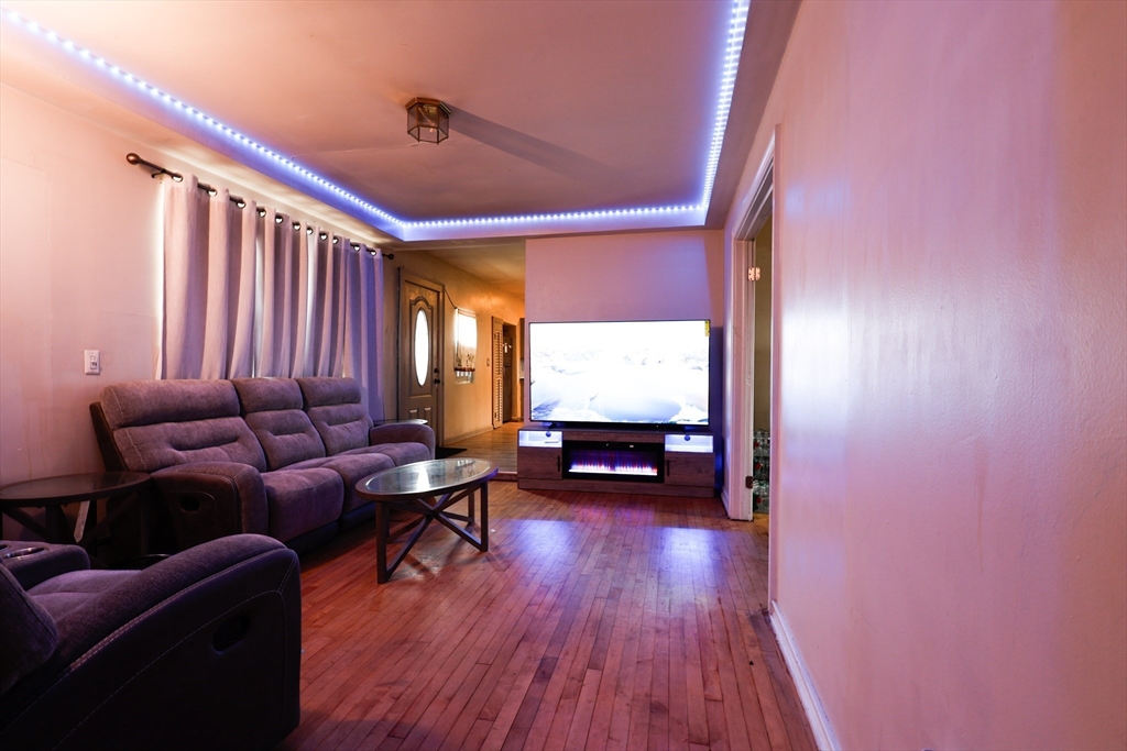 2 Horne Street Methuen, MA 01844 - Photo 4 of 11 a living room with furniture and wooden floor