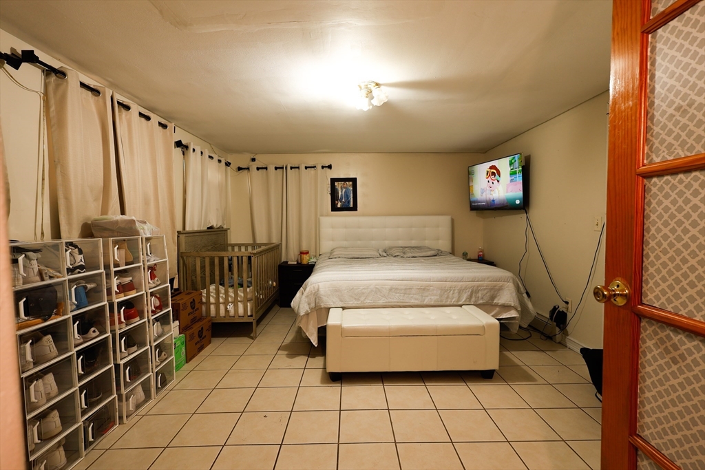 2 Horne Street Methuen, MA 01844 - Photo 6 of 11 a spacious bedroom with a bed and a window