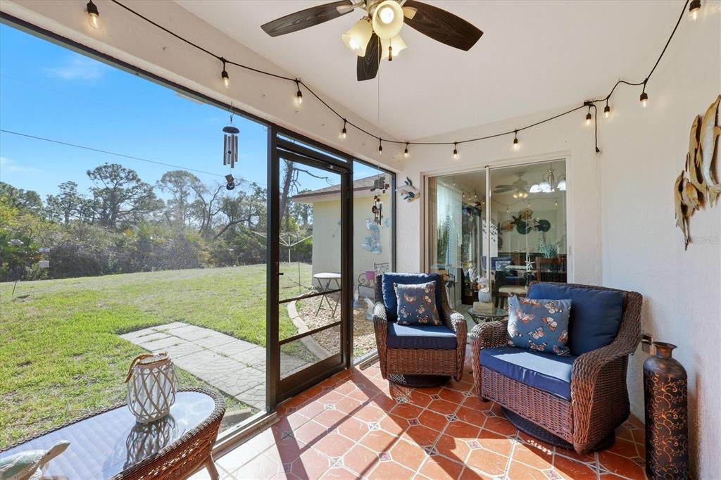 4036 Elvington Road Port Charlotte, FL 33981 - Photo 12 of 29 a outdoor living space with furniture and garden view