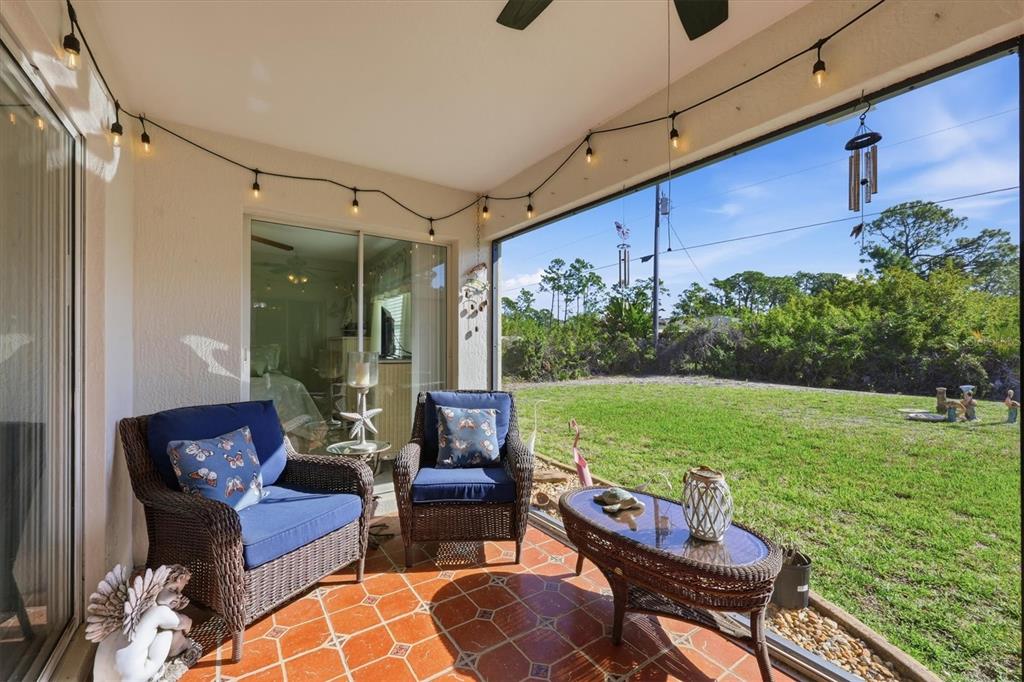4036 Elvington Road Port Charlotte, FL 33981 - Photo 13 of 29 a outdoor living space with furniture and garden view