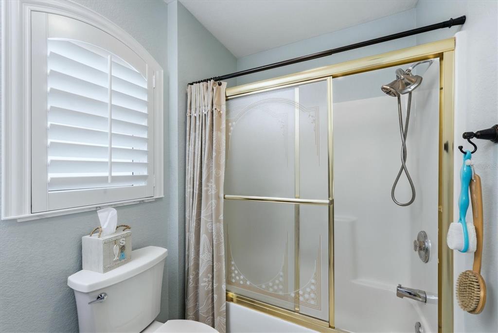 4036 Elvington Road Port Charlotte, FL 33981 - Photo 18 of 29 a bathroom with a shower sink and mirror
