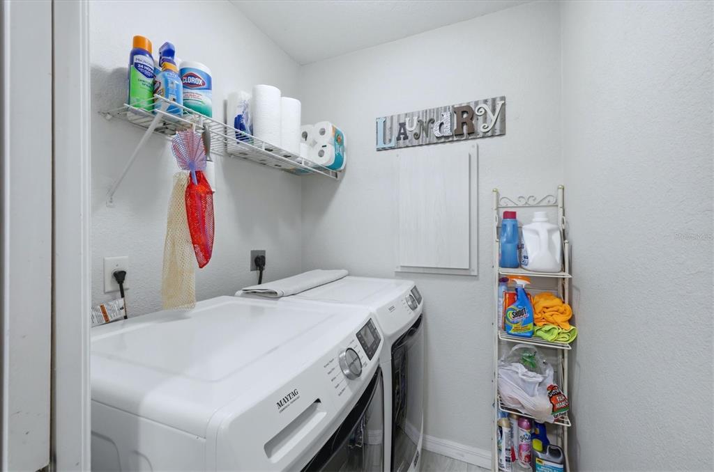 4036 Elvington Road Port Charlotte, FL 33981 - Photo 20 of 29 a utility room with dryer and washer