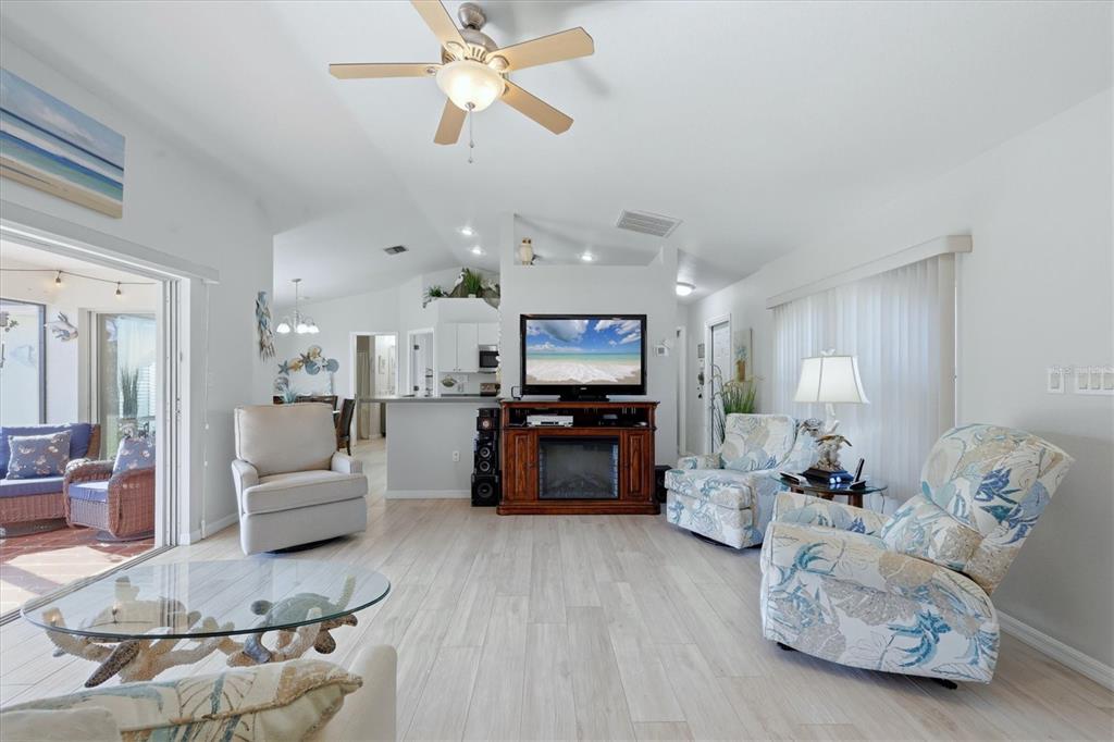 4036 Elvington Road Port Charlotte, FL 33981 - Photo 21 of 29 a living room with furniture and kitchen view