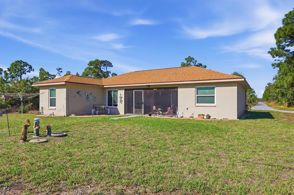 4036 Elvington Road Port Charlotte, FL 33981 - Photo 28 of 29 a view of a house with a yard