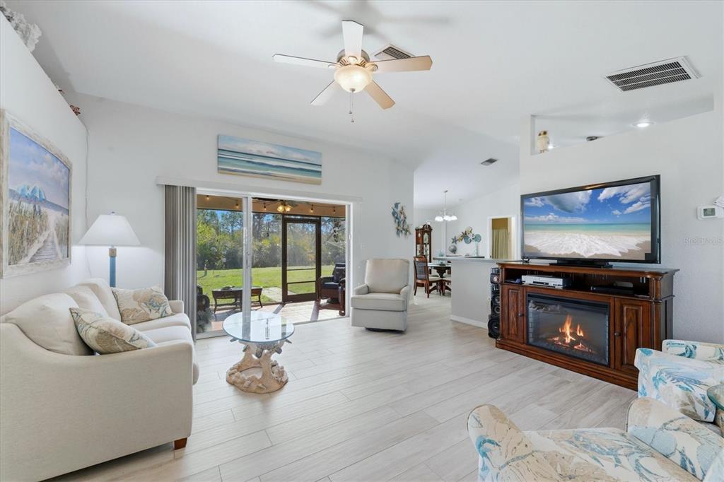 4036 Elvington Road Port Charlotte, FL 33981 - Photo 3 of 29 a living room with furniture and a flat screen tv