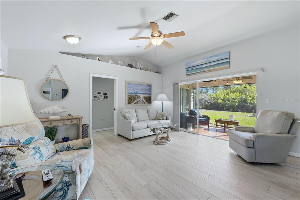 4036 Elvington Road Port Charlotte, FL 33981 - Photo 4 of 29 a living room with furniture and a large window