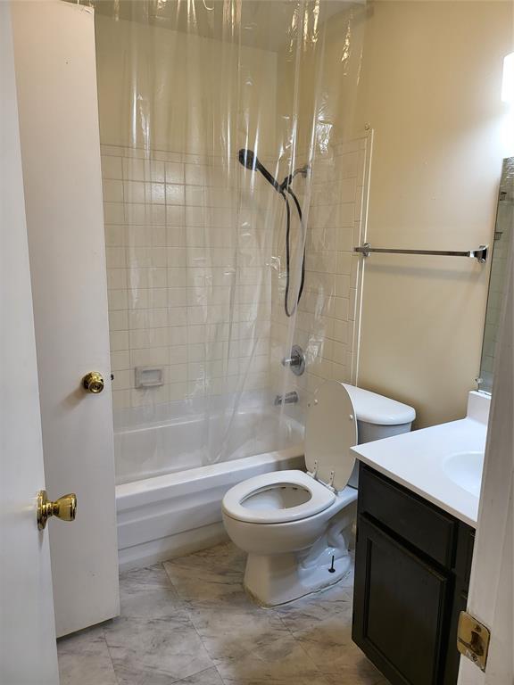 6900 Skillman Street, Unit 111 Dallas, TX 75231 - Photo 14 of 25 a bathroom with a sink a toilet and shower