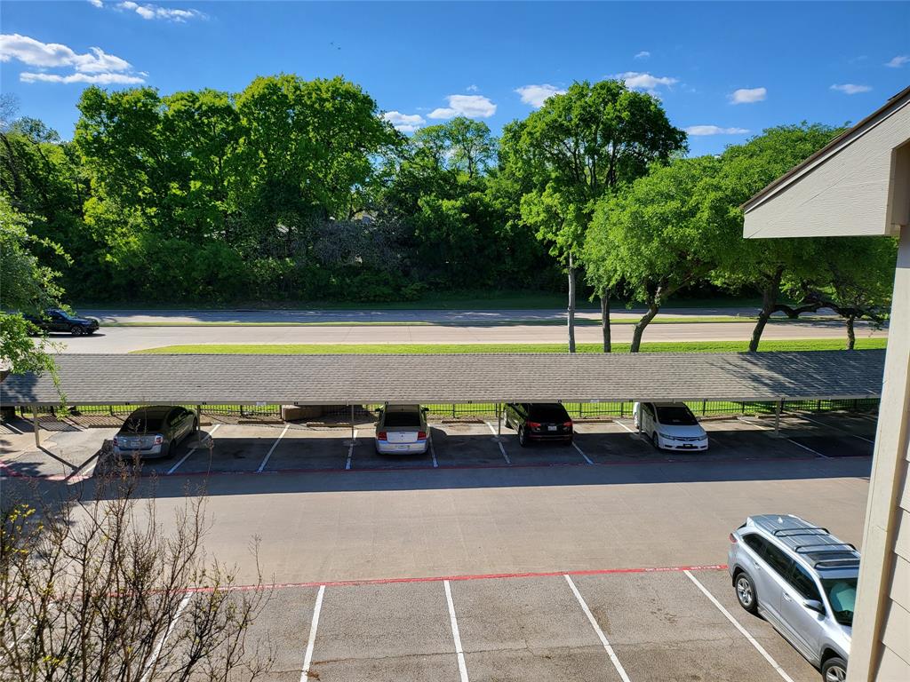 6900 Skillman Street, Unit 111 Dallas, TX 75231 - Photo 22 of 25 a view of a swimming pool with a patio and a yard