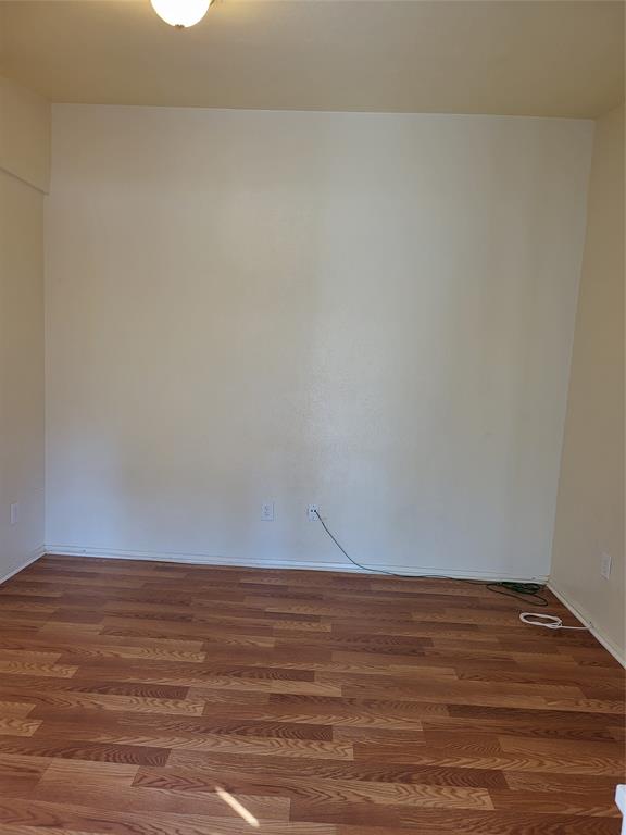 6900 Skillman Street, Unit 111 Dallas, TX 75231 - Photo 23 of 25 a view of an empty room and wooden floor