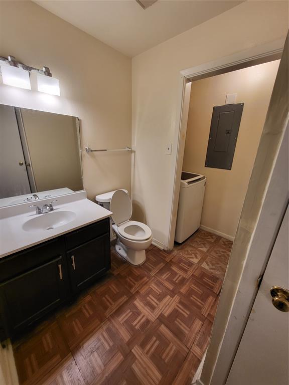 6900 Skillman Street, Unit 111 Dallas, TX 75231 - Photo 9 of 25 a bathroom with a sink and a mirror