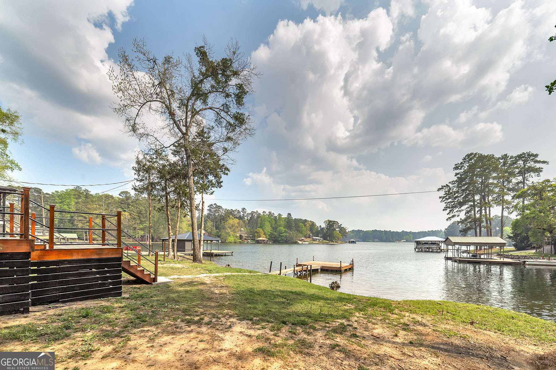 595 Barnetts Bridge Road Jackson, GA 30233 - Photo 11 of 47 a view of a lake with houses in the back
