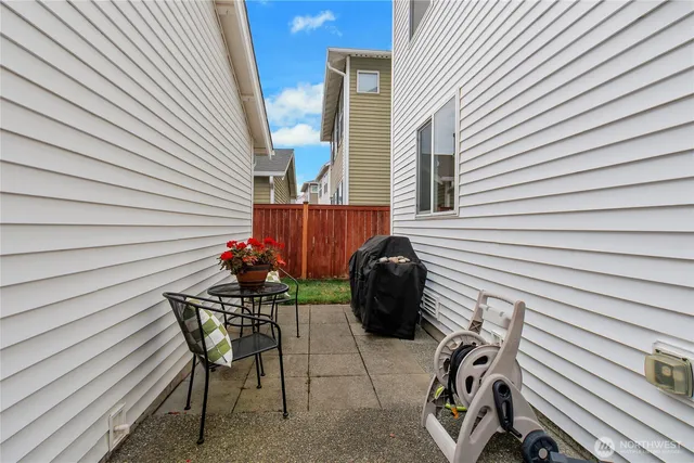 a view of a chairs and table in patio