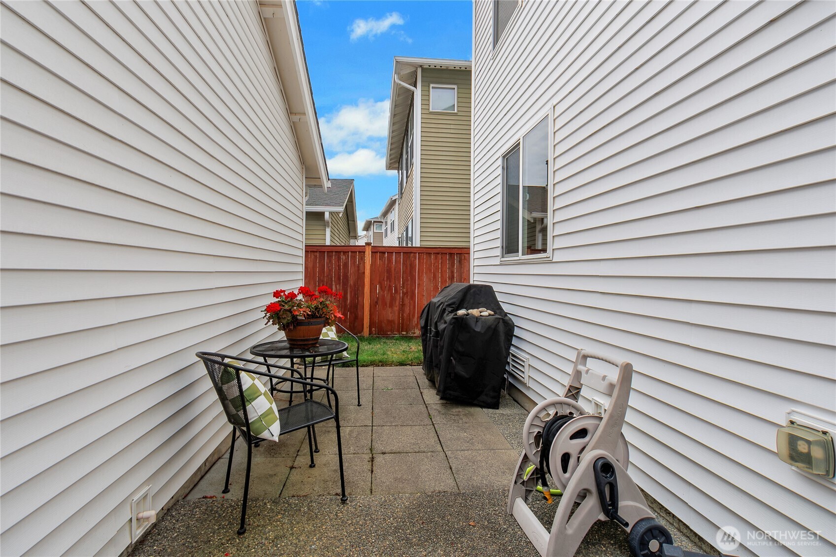 1285 Griggs Street DuPont, WA 98327 - Photo 14 of 23 a view of a chairs and table in patio