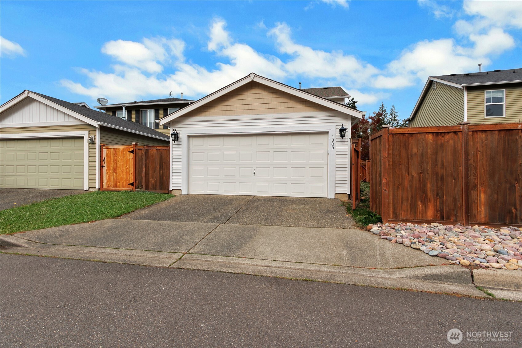 1285 Griggs Street DuPont, WA 98327 - Photo 16 of 23 a view of backyard of house and garage