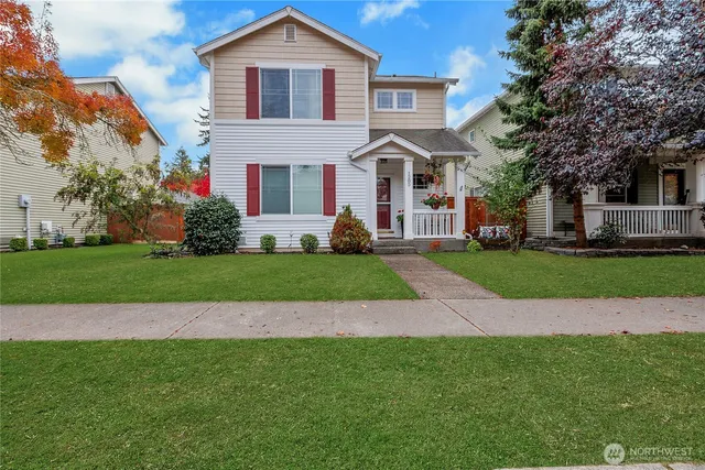 a front view of a house with a yard
