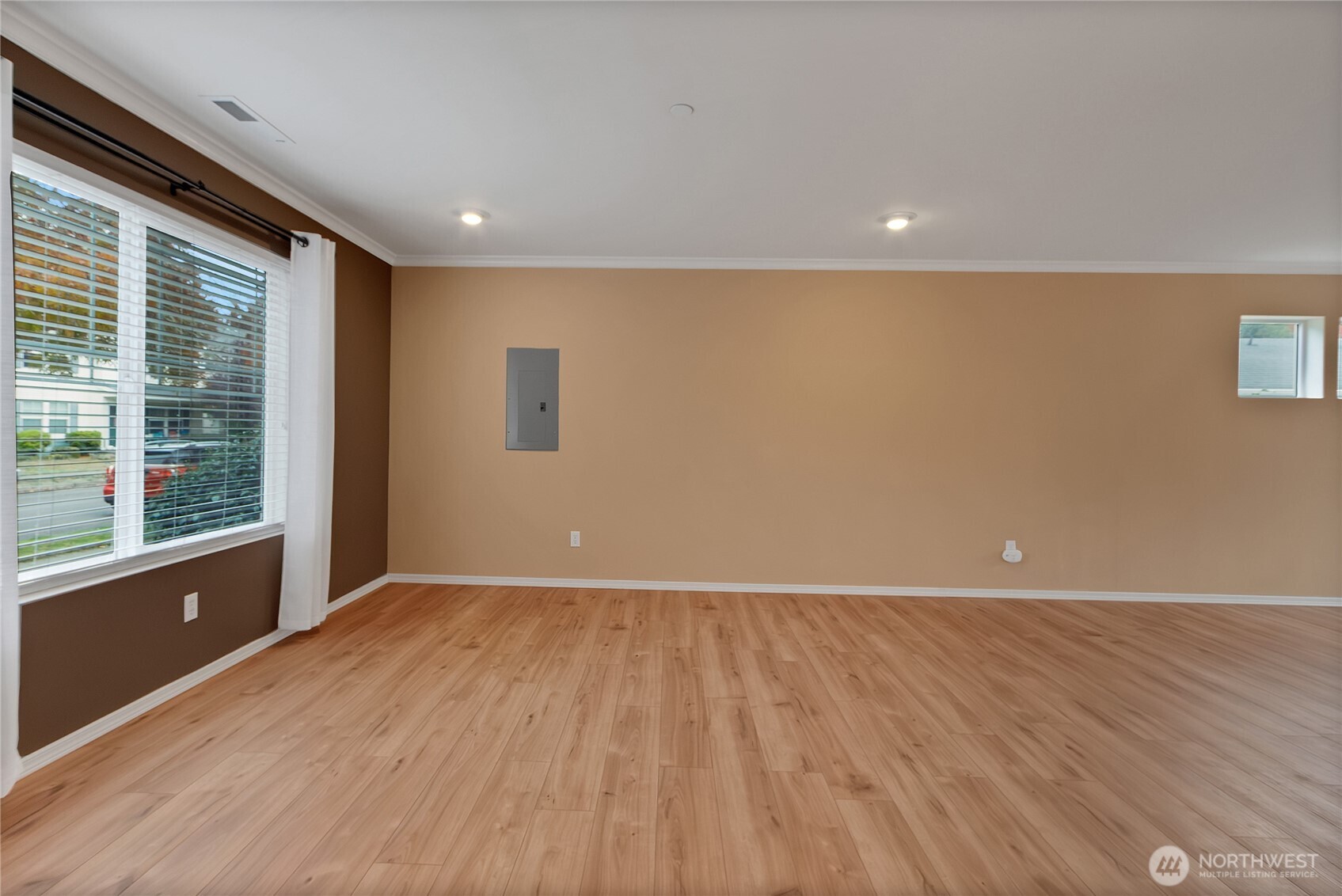 1285 Griggs Street DuPont, WA 98327 - Photo 5 of 23 a view of an empty room with wooden floor and a window