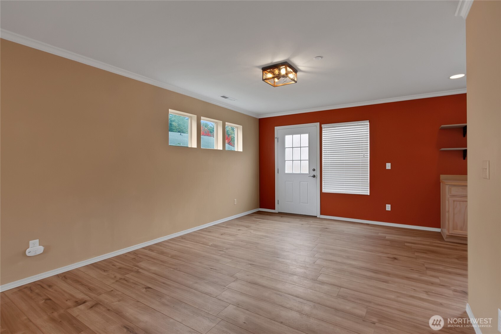 1285 Griggs Street DuPont, WA 98327 - Photo 7 of 23 a view of an empty room with wooden floor and a window