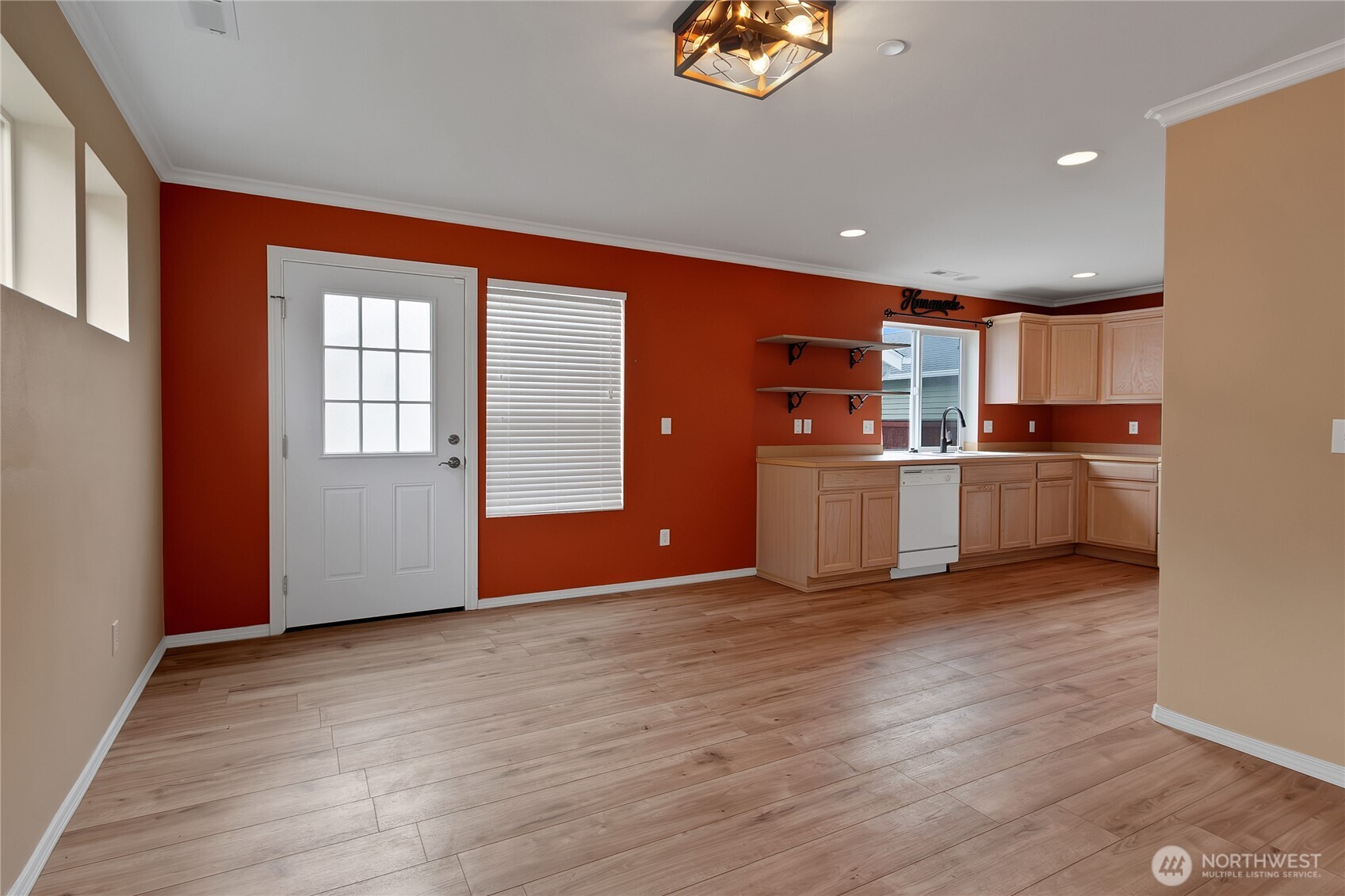 1285 Griggs Street DuPont, WA 98327 - Photo 8 of 23 a view of a kitchen with a sink wooden floor and a window