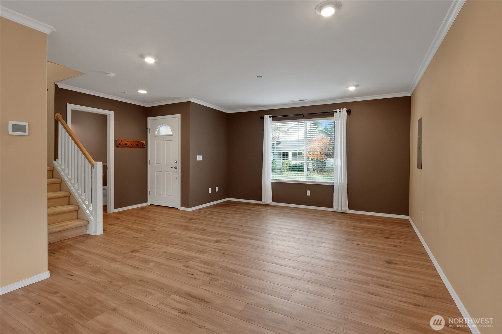 1285 Griggs Street DuPont, WA 98327 - Photo 9 of 23 a view of an empty room with wooden floor and a window